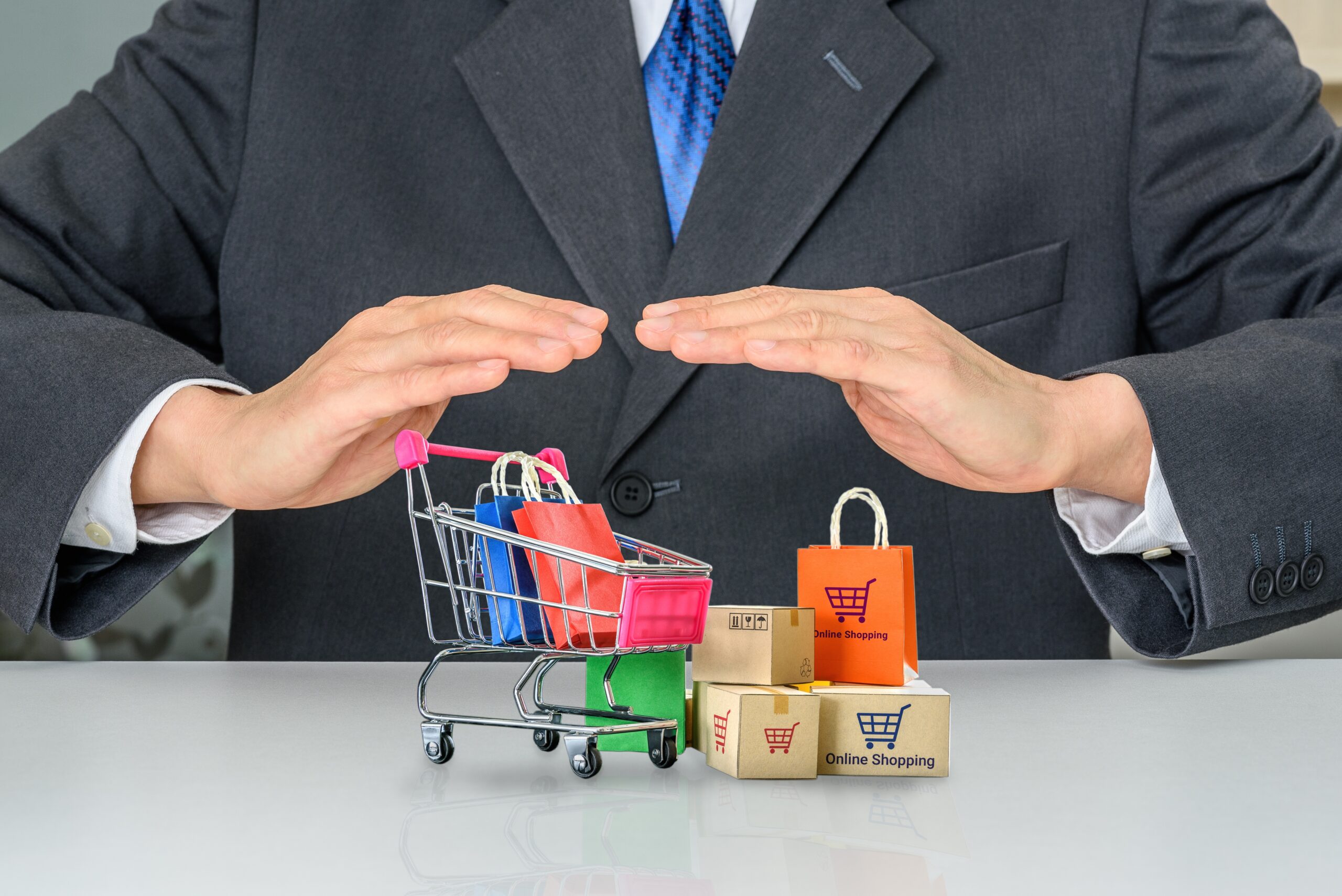 Business professional protecting shopping cart and packages representing consumer rights and product liability law