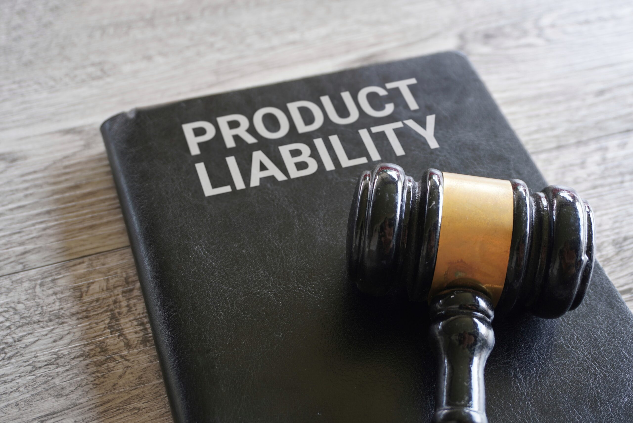 Gavel on book labeled product liability representing legal cases and need for a product liability lawyer in Texas